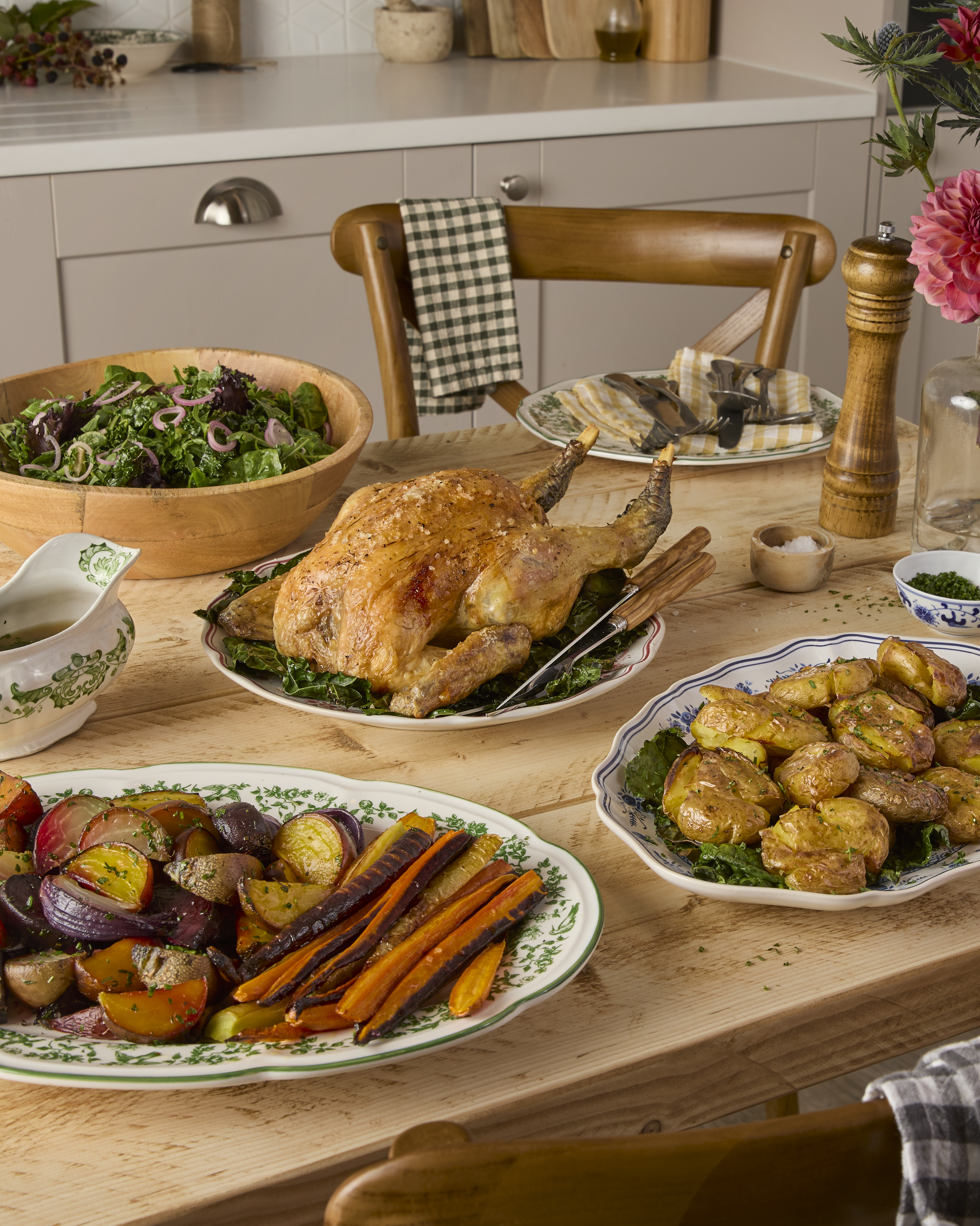 Whole Norfolk Black Chicken with golden potatoes and skin-on seasonal trimmings