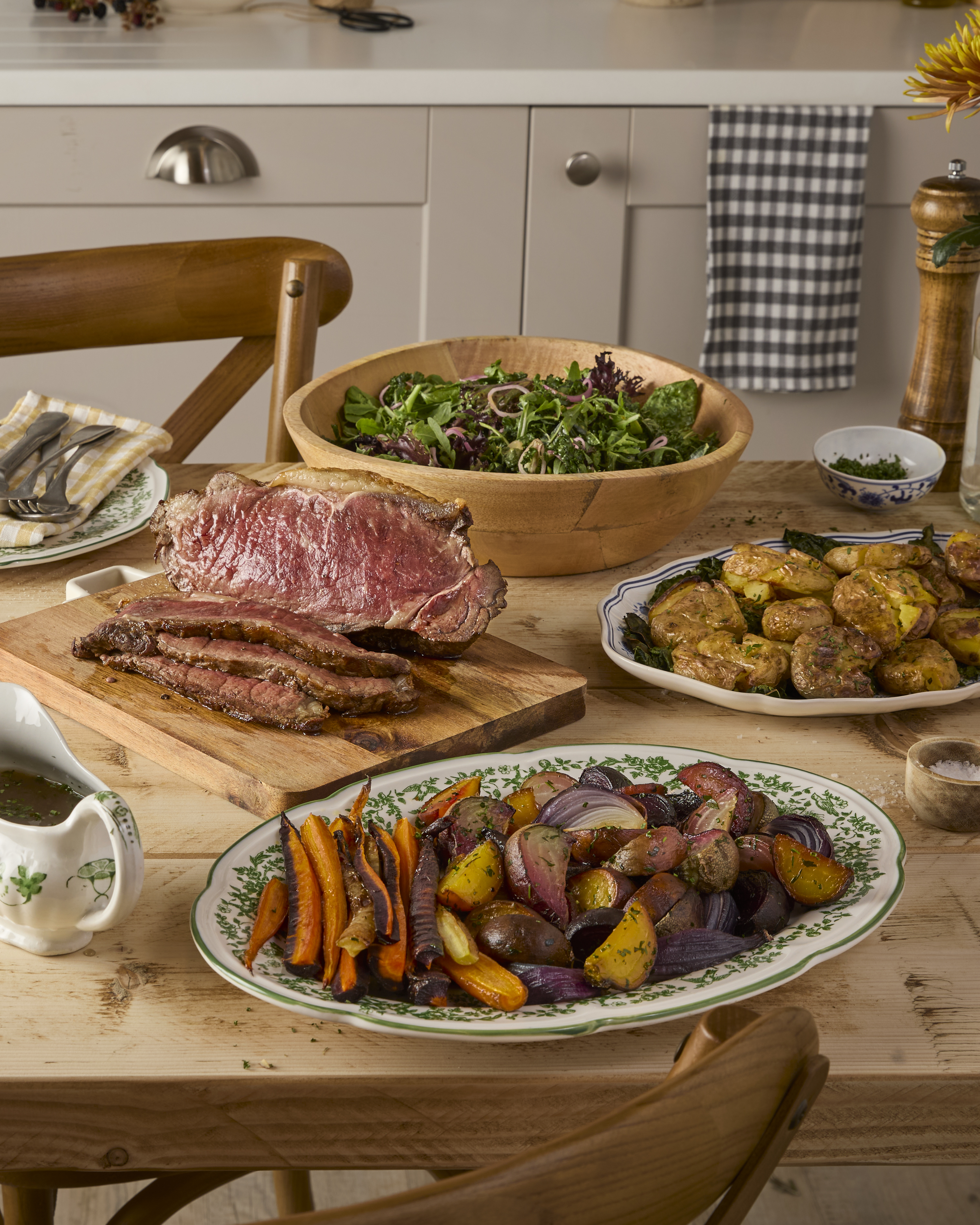 Grass-fed Aberdeen Angus Beef Sirloin with golden potatoes and skin-on seasonal trimmings