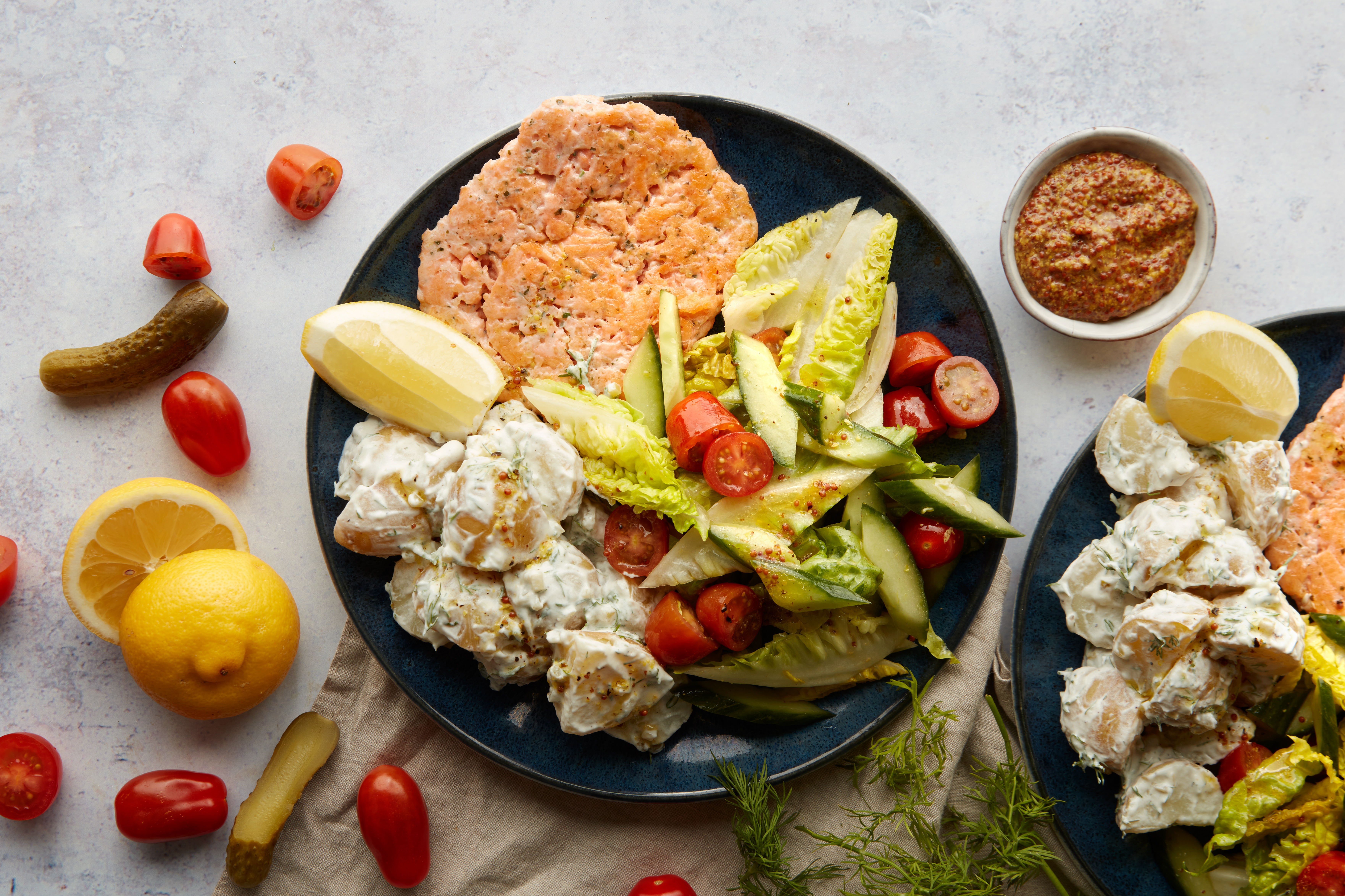 Lemon salmon burger with tartar potato salad