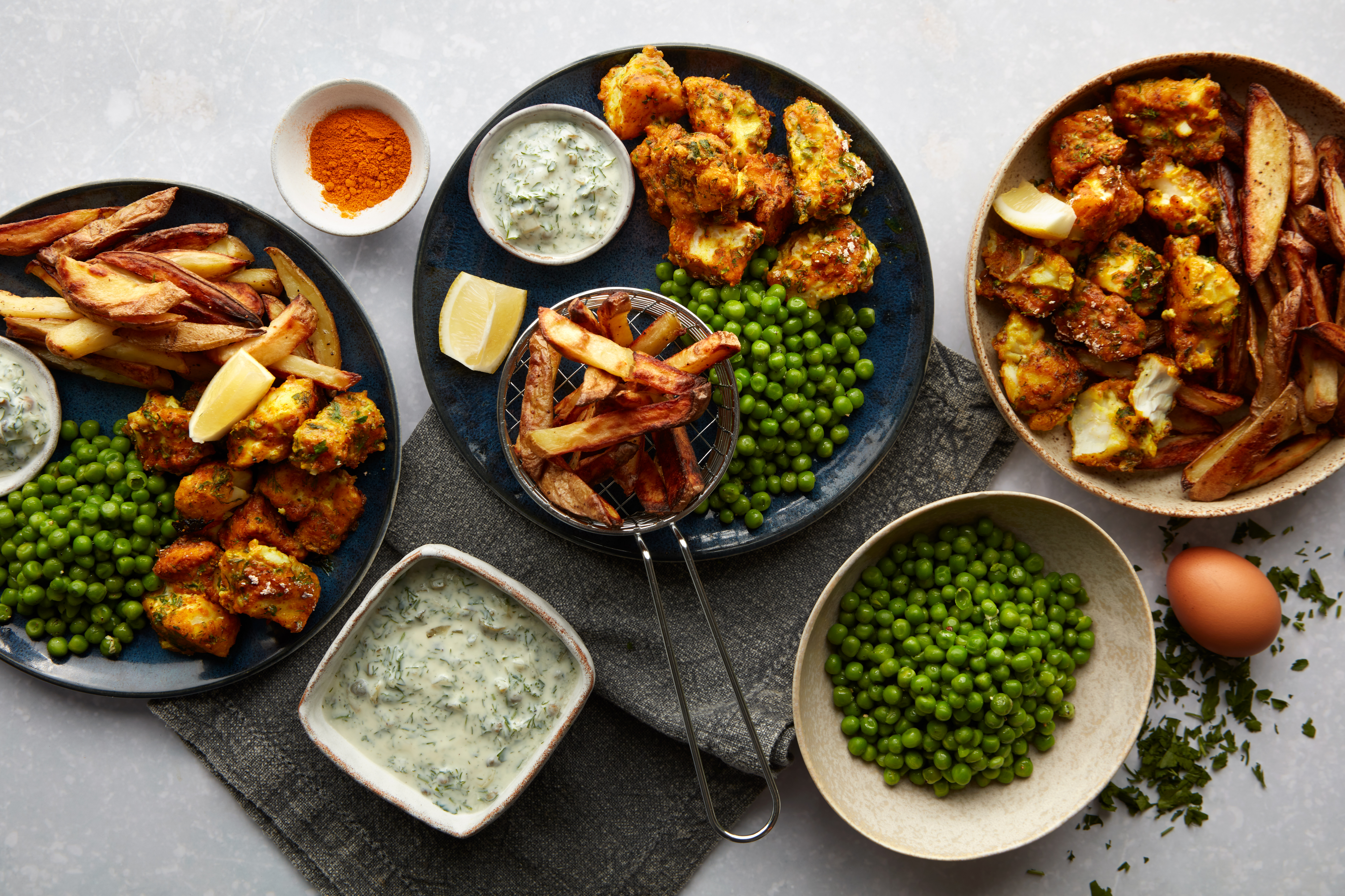 Cajun coley bites with chips, peas & tartar sauce