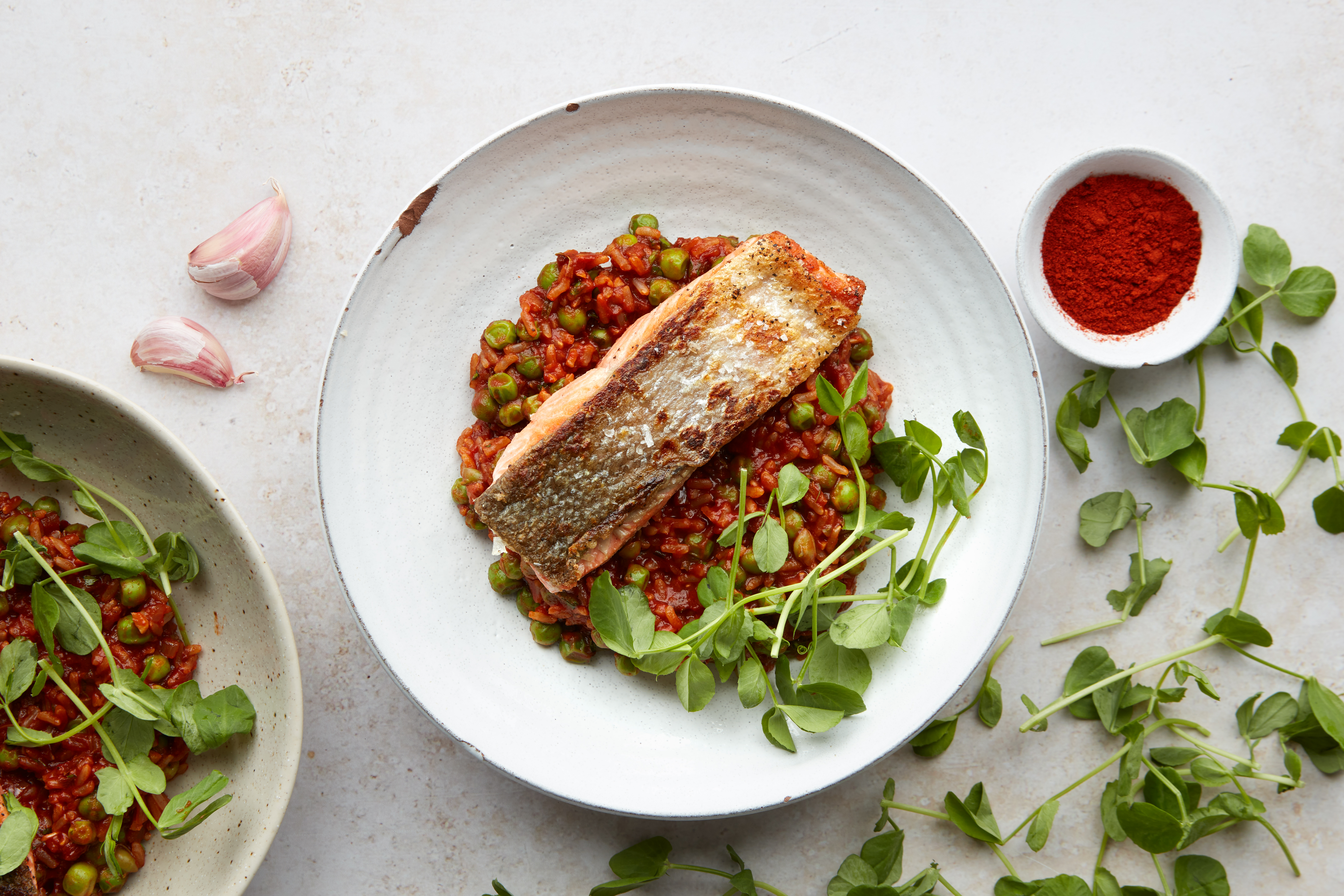 Sockeye salmon with smoky pea risotto & pea shoots