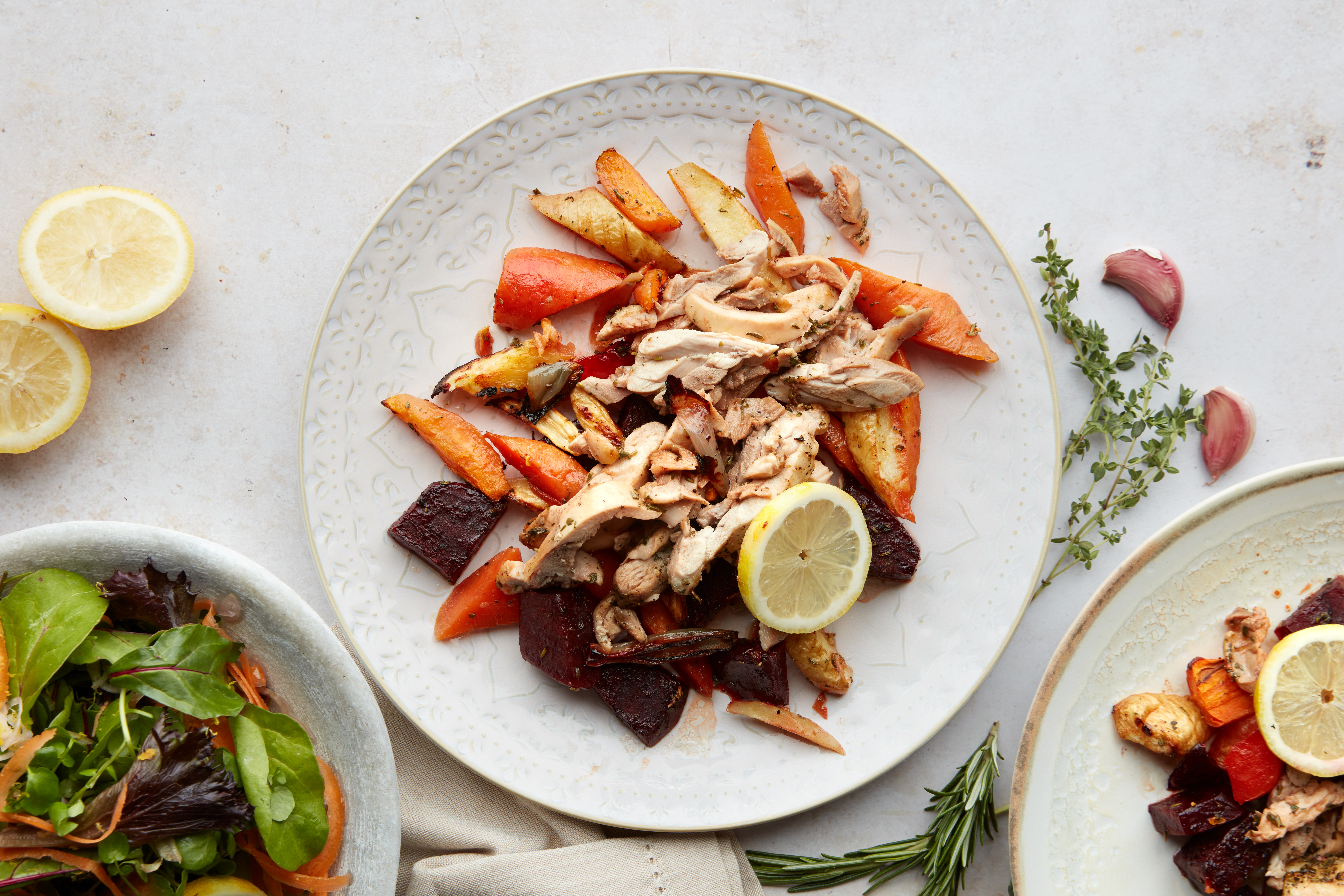 Herby garlic chicken with roasted veg & rocket