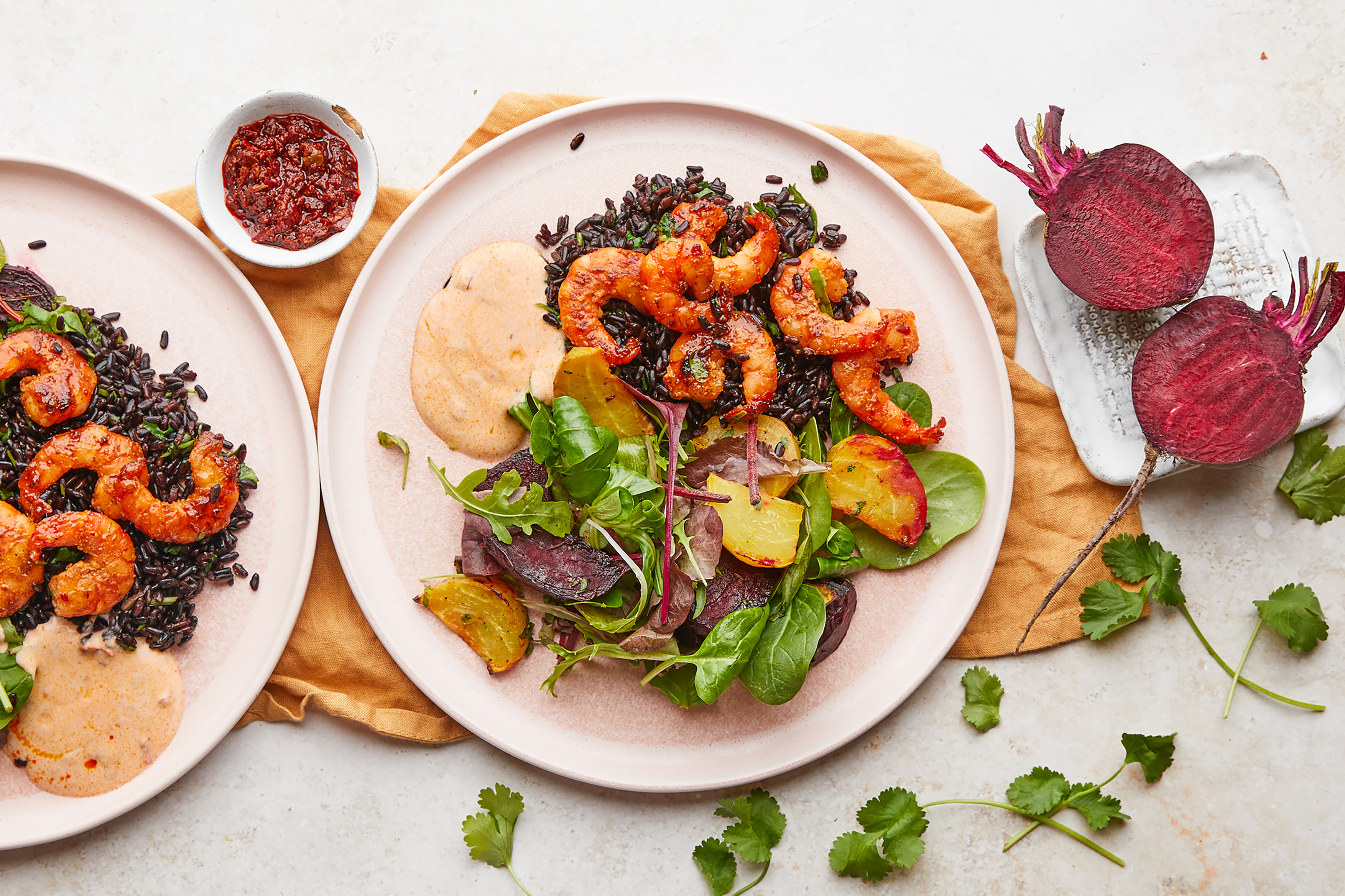 Honey and harissa tiger prawns with beetroot salad