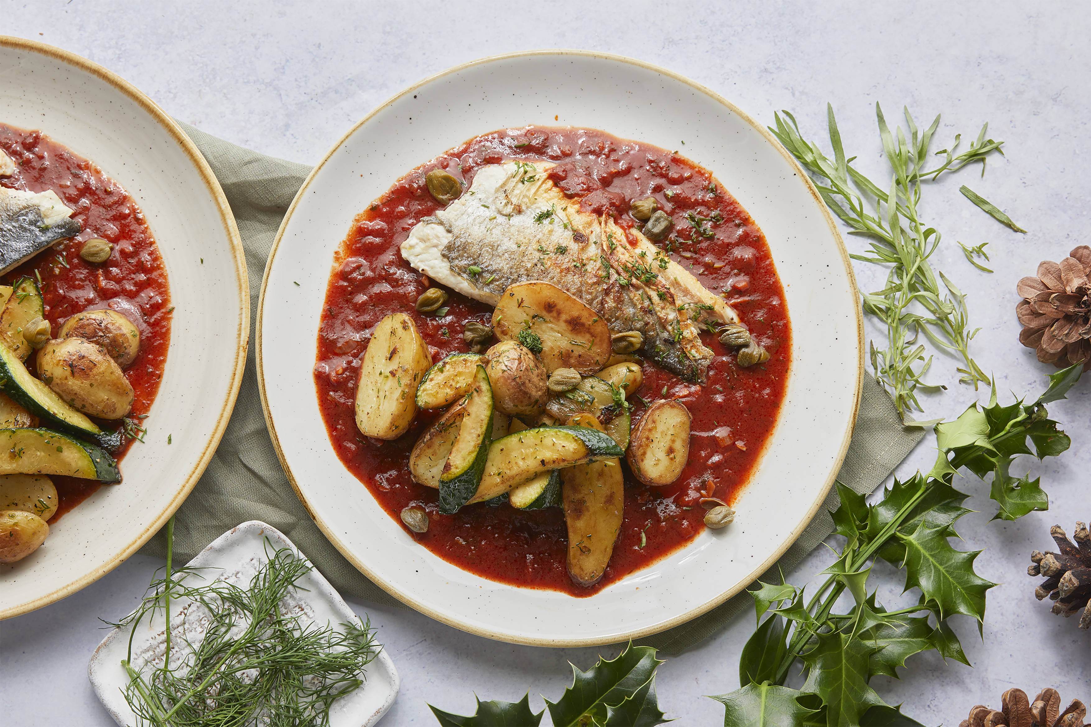 Crispy sea bass, smoky tomato sauce & capers