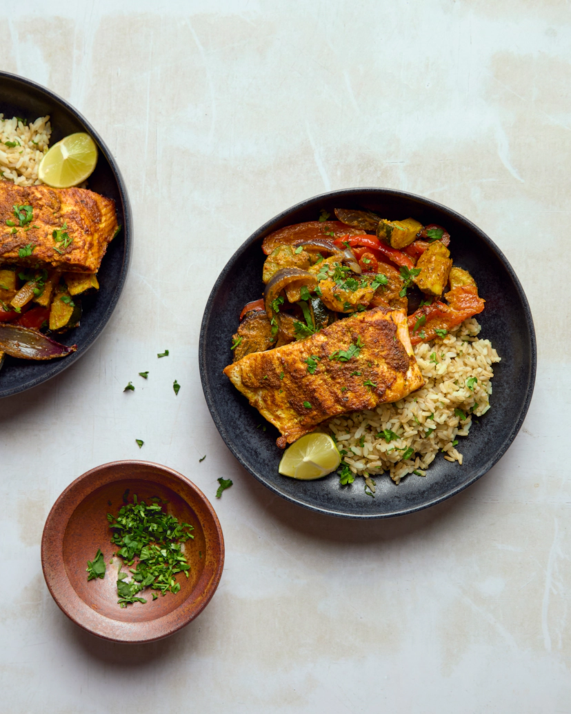 Your Mindful Chef take on tikka uses succulent, responsibly-sourced salmon – coated in creamy coconut and fragrant tikka spices. Roast alongside juicy peppers, vibrant courgette and sweet onion for the perfect traybake. Fluffy brown rice, flavoured with bright lime zest and fresh-cut coriander, soaks up all that delicious flavour.