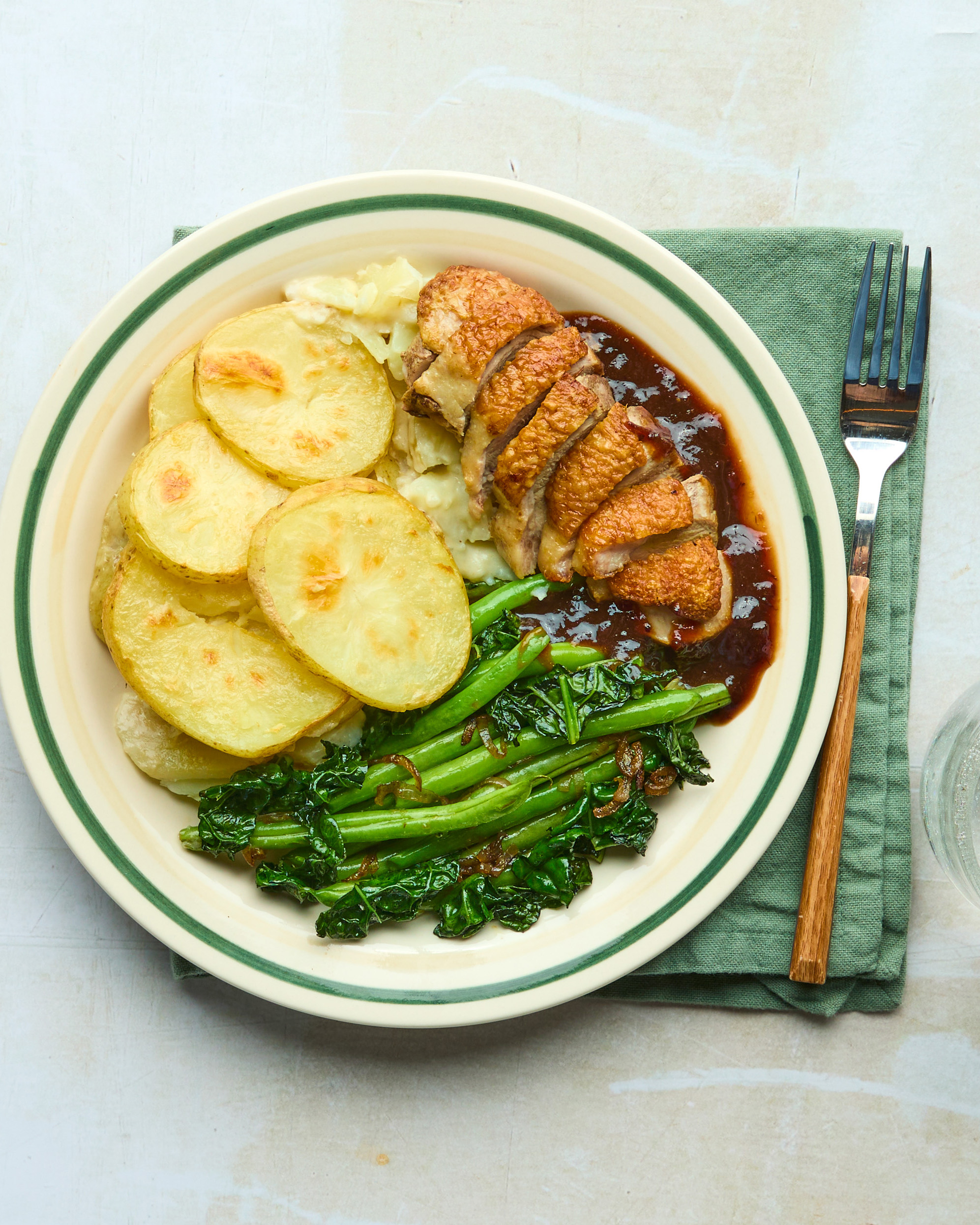 Pan-roasted Duck Breast with Truffled Dauphinoise, Greens & Cranberry Sauce