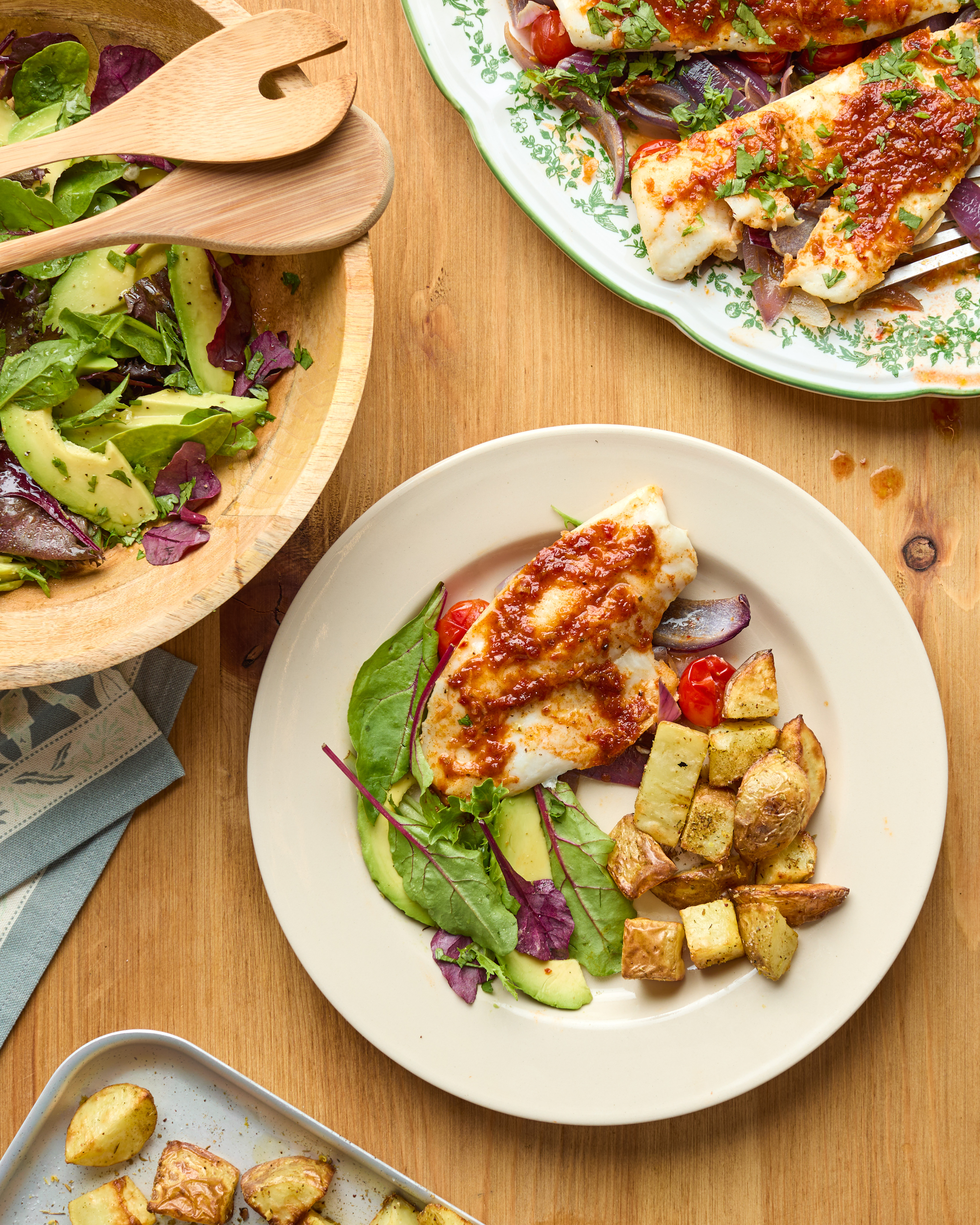 Honey Harissa Hake Traybake with Zesty Za'taar Potatoes and Avocado Salad